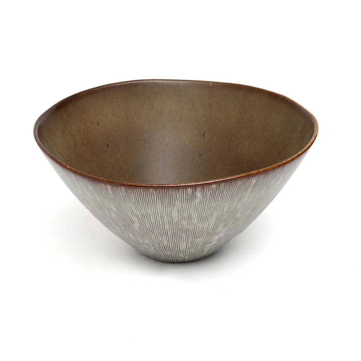 Brown ceramic bowl with textured interior on a white background