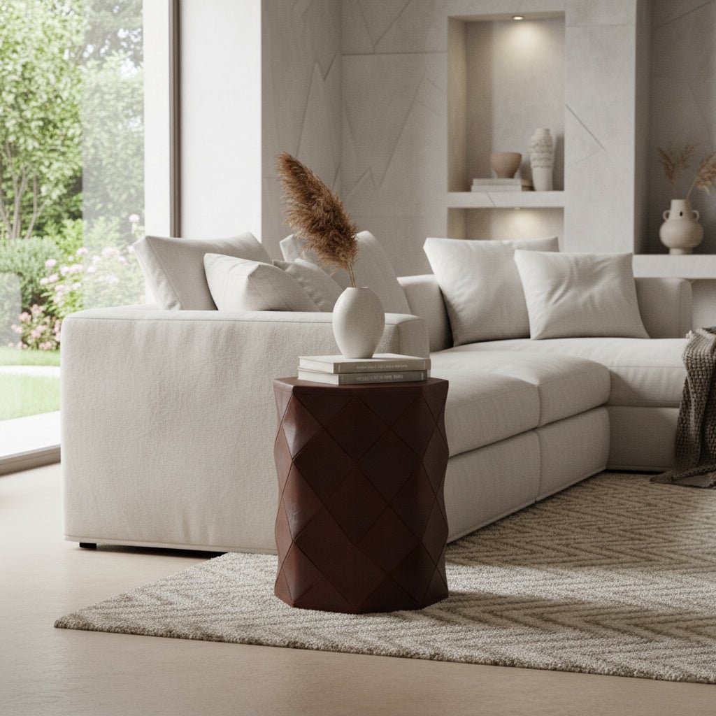 Modern living room with a beige sectional sofa, decorative pillows, and a dark brown side table.