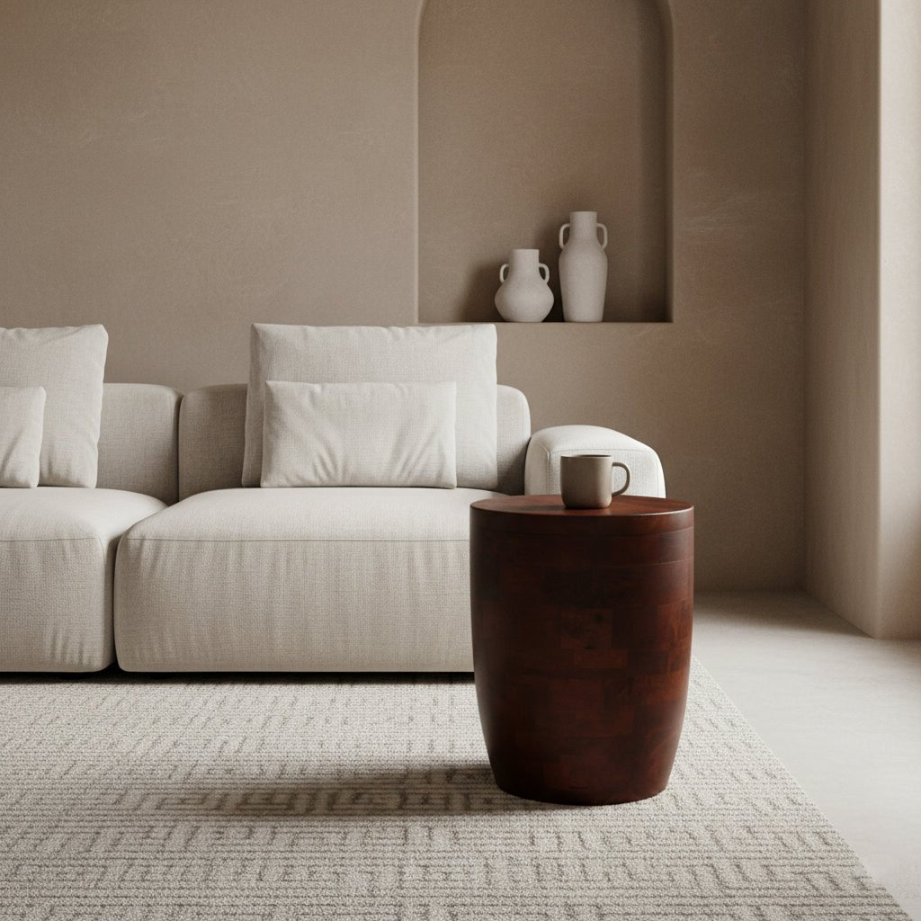 Modern living room with a beige sofa, wooden side table, and decorative vases.