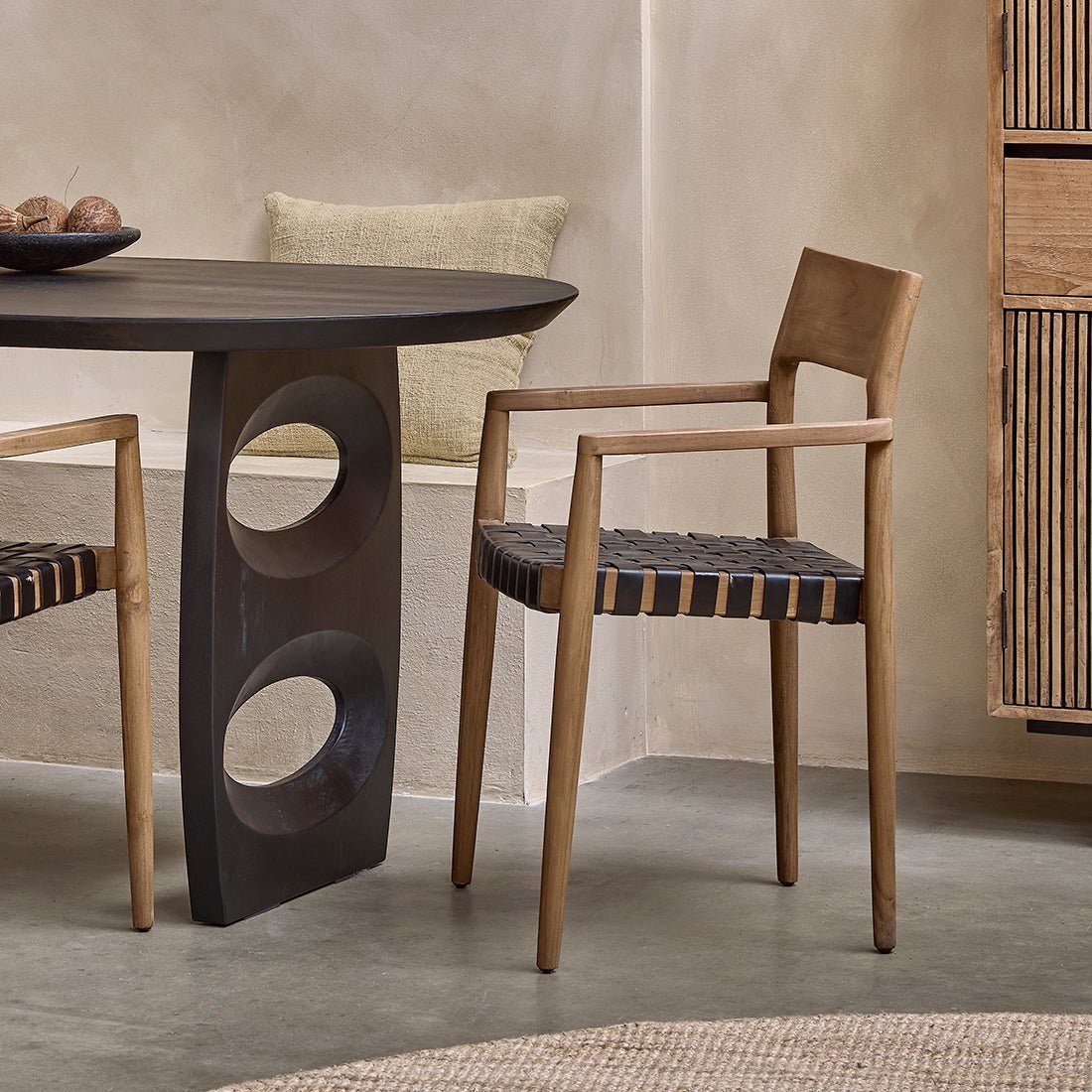 Dining table with wooden chairs in a modern interior setting
