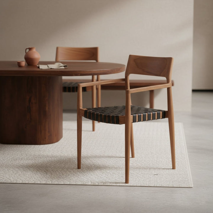 Wooden dining table with chairs in a minimalistic room