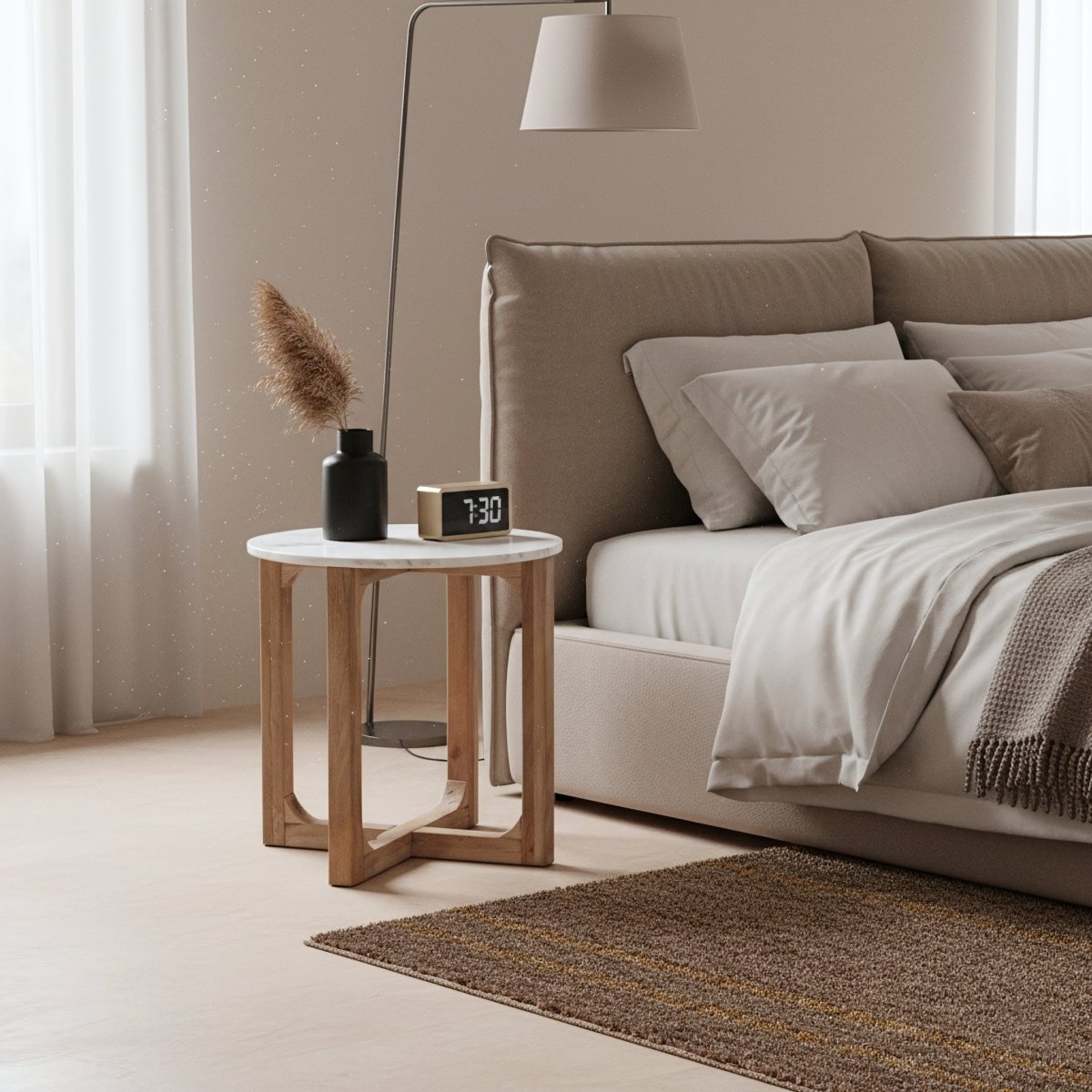 Modern bedroom with a bed, side table, and lamp.