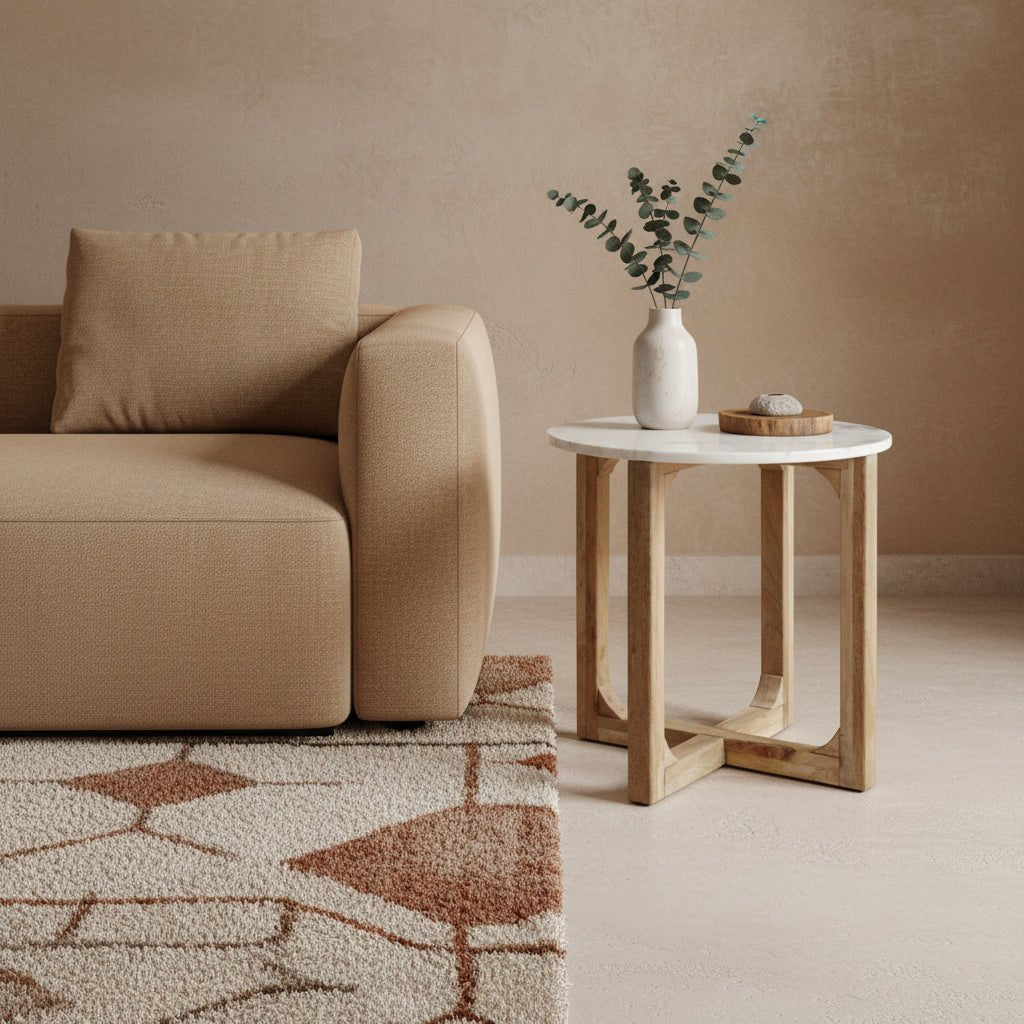 Beige sofa with a side table and decorative items in a minimalistic living room.