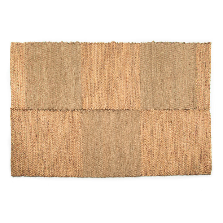 Rectangular jute rug with a natural brown pattern on a white background