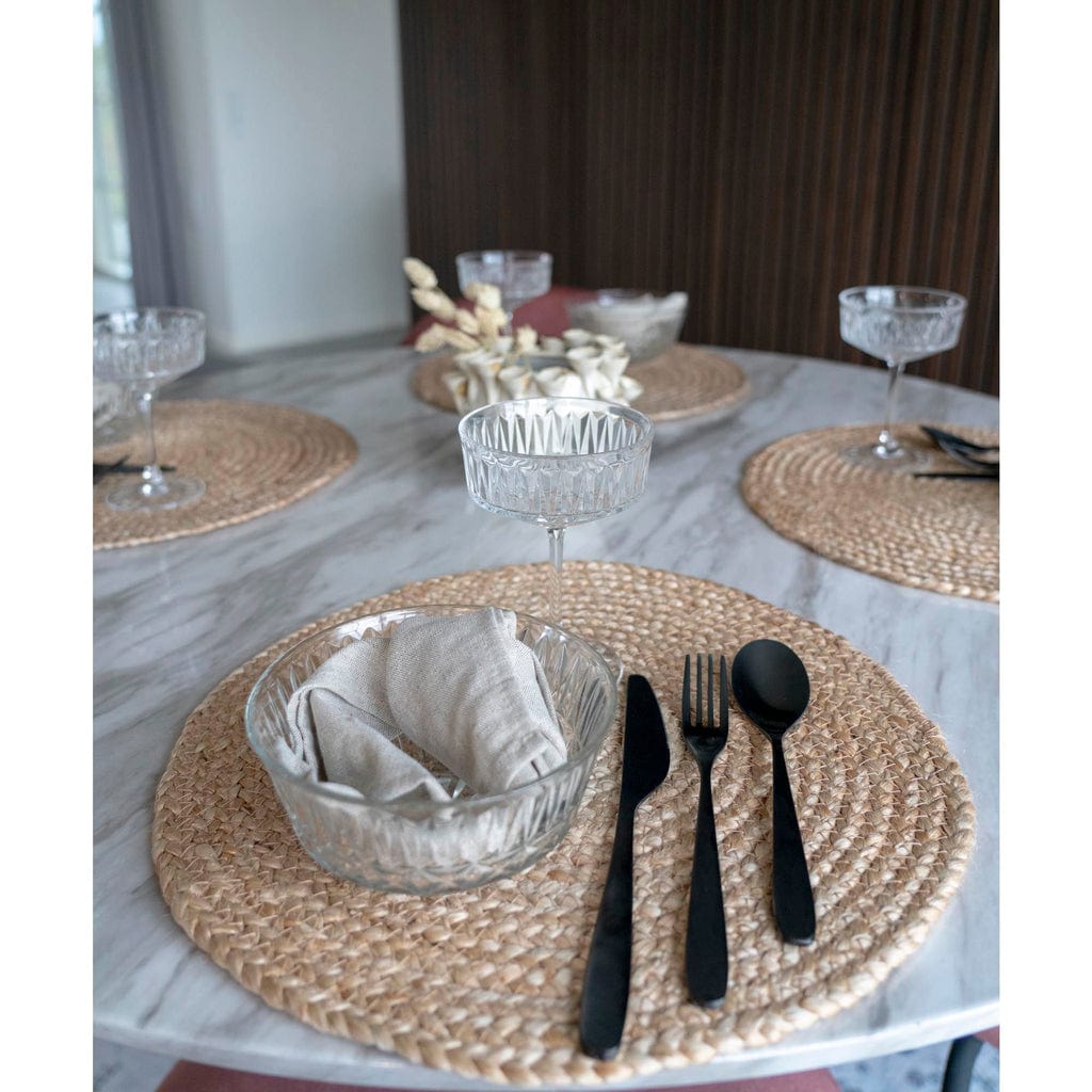 Round braided natural jute placemats set of 4, Ø38 cm, on a dining table.