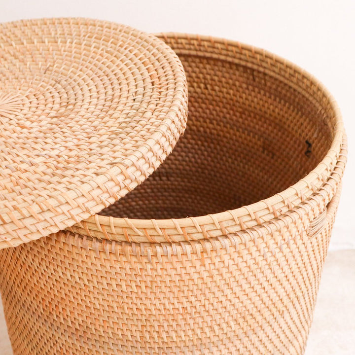 Woven basket with a lid on a light background
