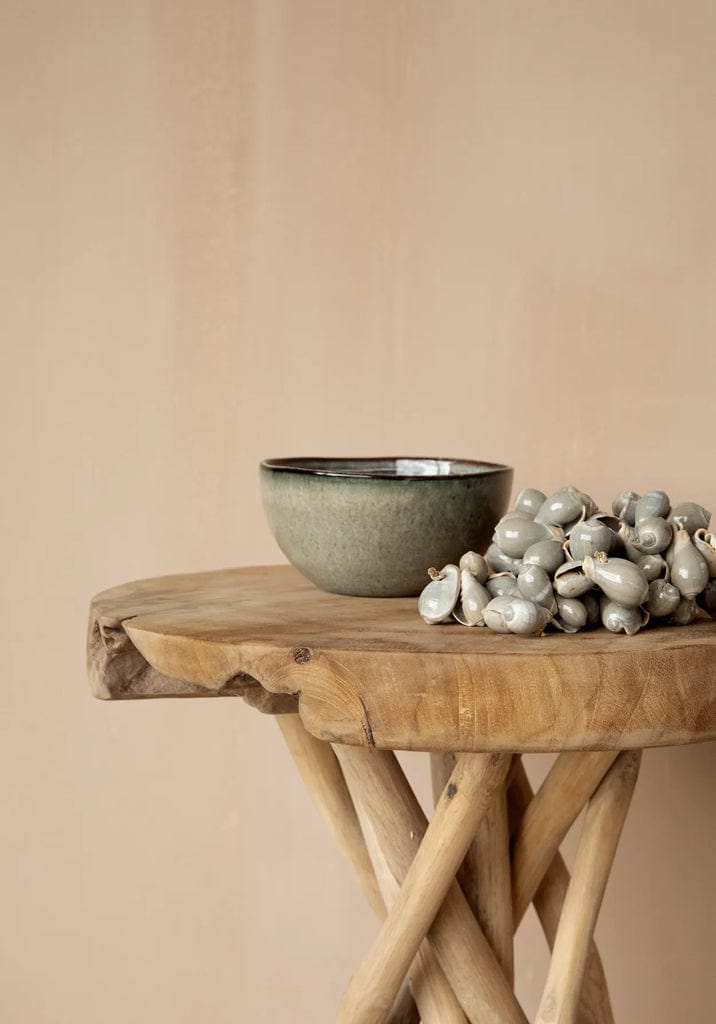 Comporta Cornflakes Bowl 15cm on wooden table, showcasing artisanal crackle glaze in greenish blue tones.