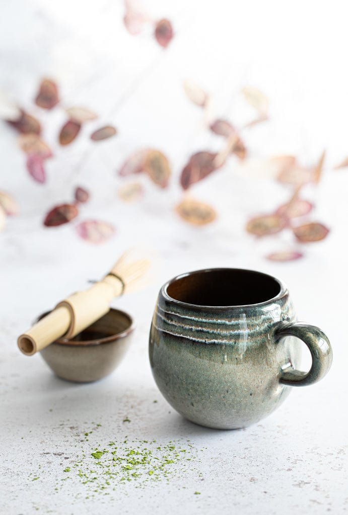 The Comporta Coffee Cup - L, part of a set of 6, crafted from earthenware with elegant design, ideal for sophisticated table settings.