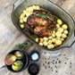 Comporta Oven Dish in green with crackle glaze, displaying roasted chicken and potatoes.