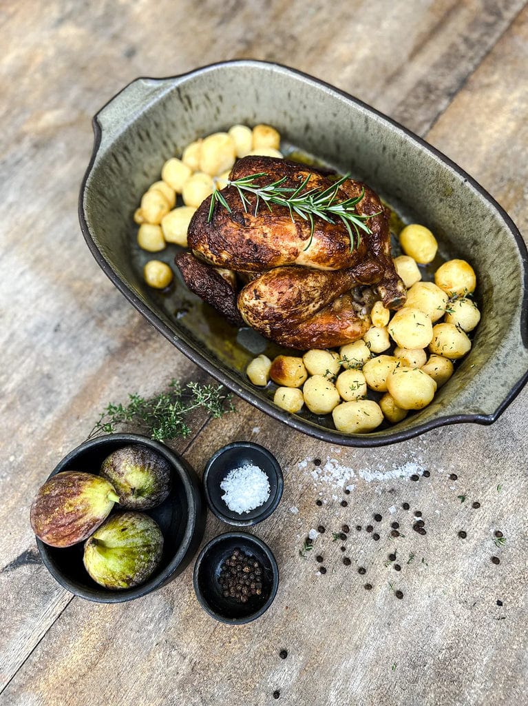 Comporta Oven Dish in green with crackle glaze, displaying roasted chicken and potatoes.