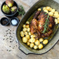 Green Comporta oven dish with roasted chicken and potatoes.