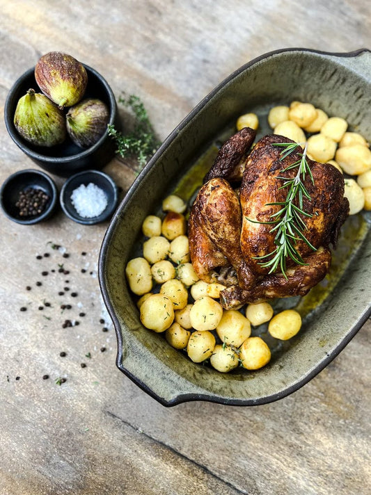 Green Comporta oven dish with roasted chicken and potatoes.