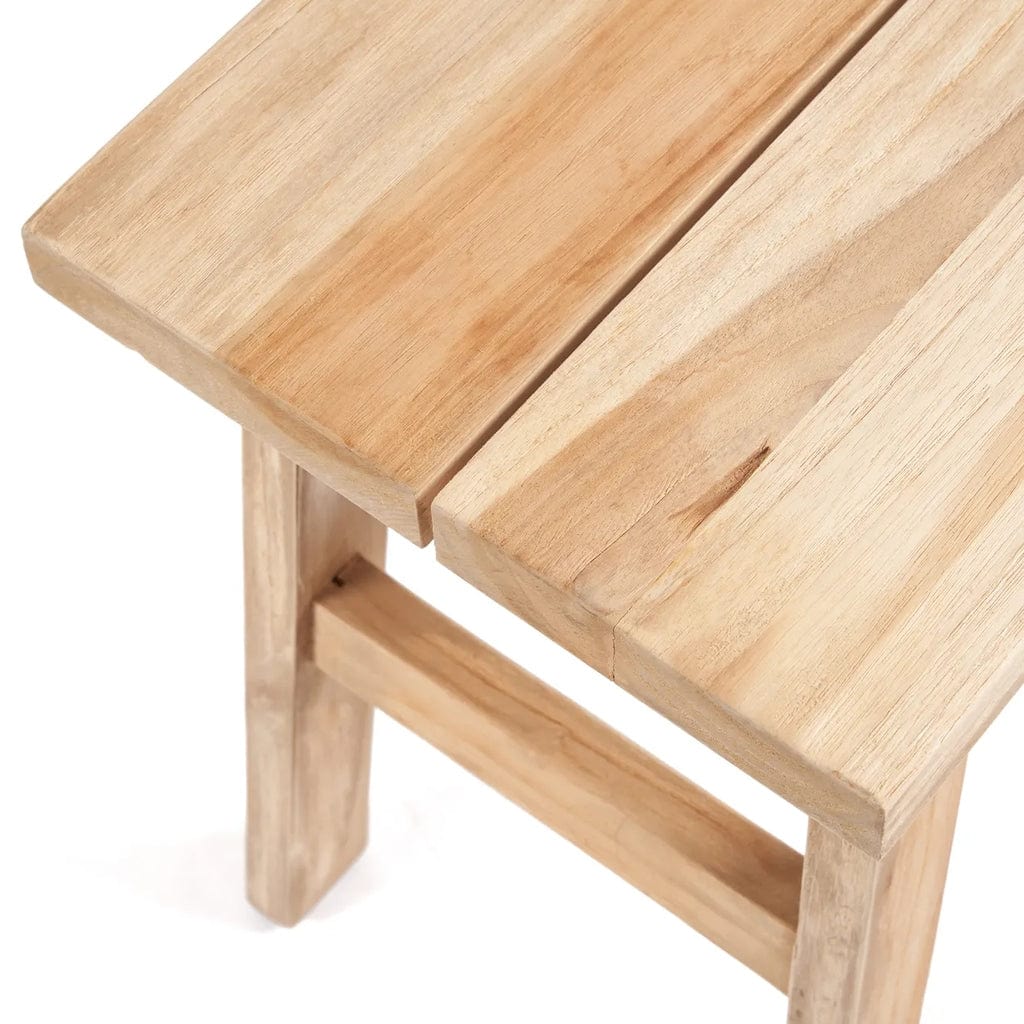 Makara Stool made from natural reclaimed teak wood with a natural finish showcasing unique grain patterns.