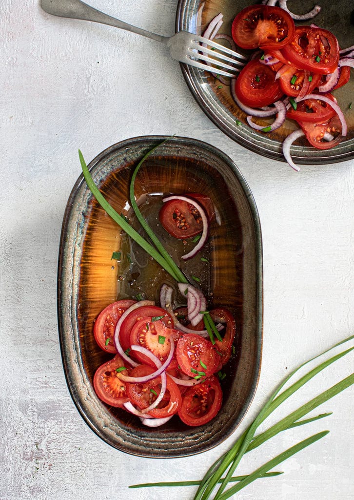 Comporta Oval Bowl 25cm with salad, unique color variations and crackle glaze.