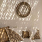 Raffia Macramé Wall Decoration in white and natural, enhancing a bohemian, coastal interior with artisanal charm.