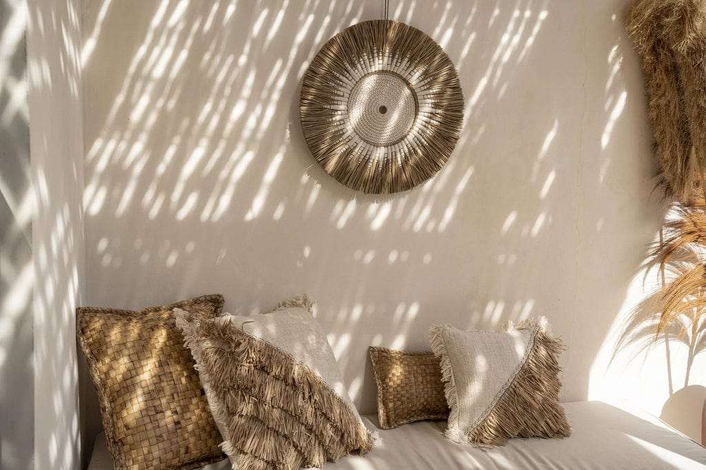 Raffia Macramé Wall Decoration in white and natural, enhancing a bohemian, coastal interior with artisanal charm.