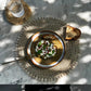 Seagrass Shell Placemat with cowrie border on a dining table.