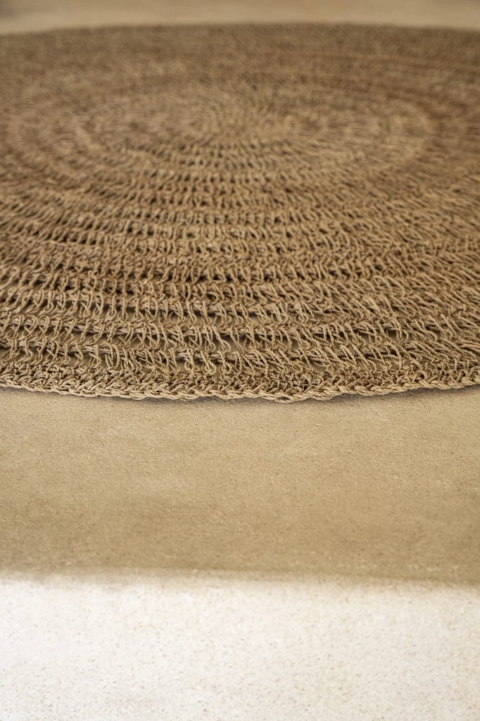 Circular seagrass rug, natural color, 100cm diameter, handcrafted from raffia, sisal, and palm.