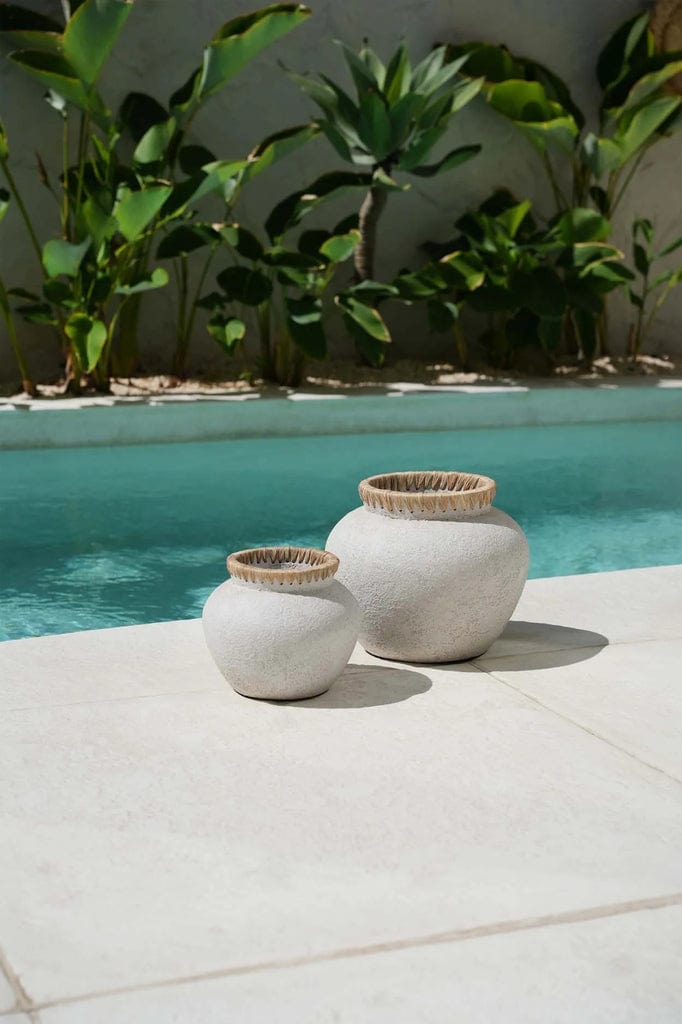 Styly Vase in natural concrete with raffia detail by a poolside.