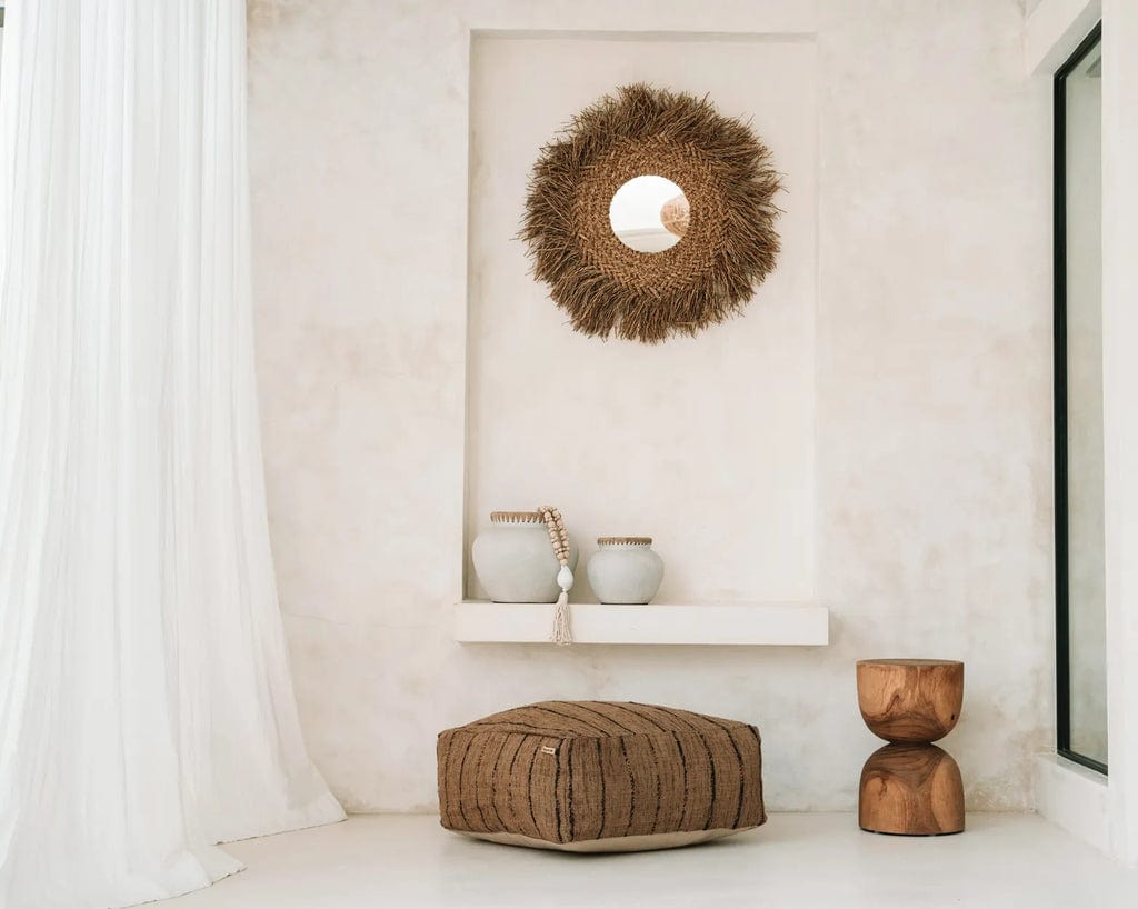 Styly Vase in natural concrete, terracotta with raffia detail, displayed in a coastal-themed indoor space.