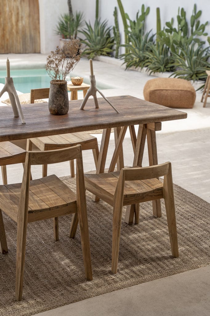 Ydra Dining Chair - Natural - Outdoor placed in a stylish patio setting with a wooden table.