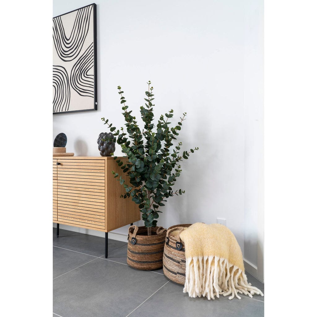 Erba Banana Leaf Baskets, natural set of 2, used as decorative accents in modern living space.