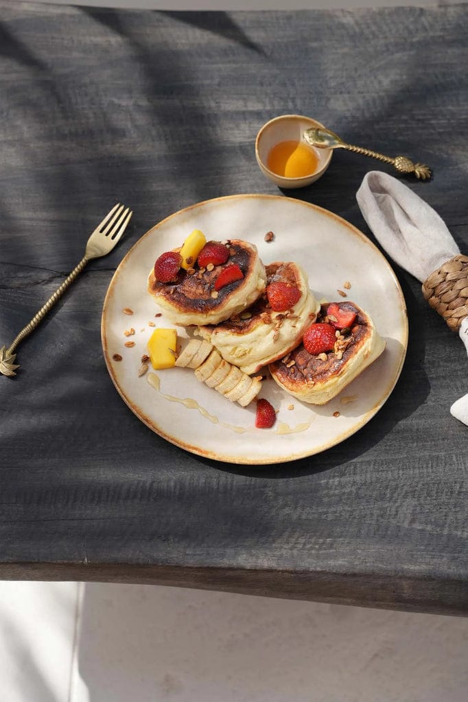 Cascais Salad Plate 22cm set with pancakes and fruit on a dark table.