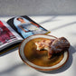 Comporta Appetizer Plate 17cm with pastry, showcasing handcrafted Portuguese ceramic and crackle glaze.