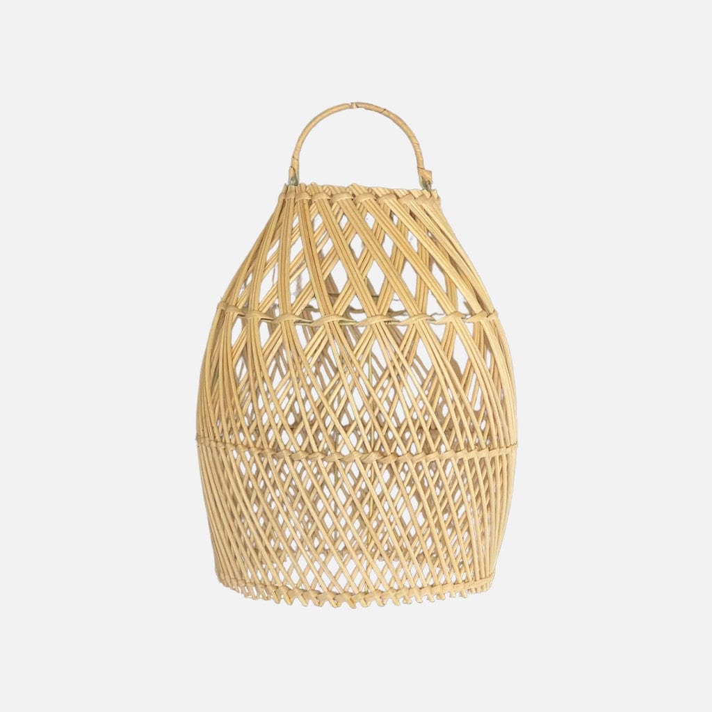 "Handmade Laga Rattan Lampshade hanging in a room, adding coastal charm to the decor"