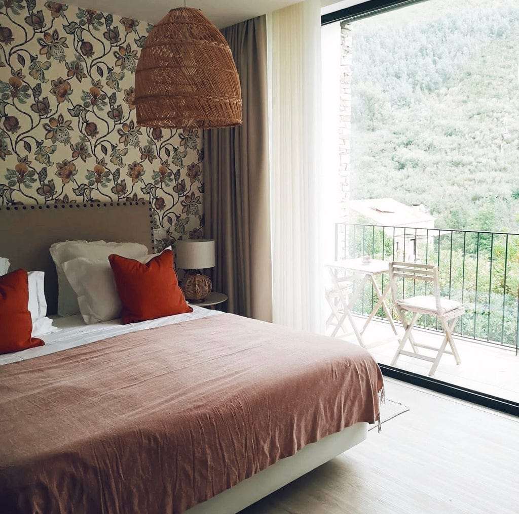 Handcrafted rattan lampshade with wicker design in cozy bedroom setting.