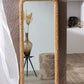 Rectangle fir wood mirror with rattan detail in a natural finish, adding rustic charm to interiors.