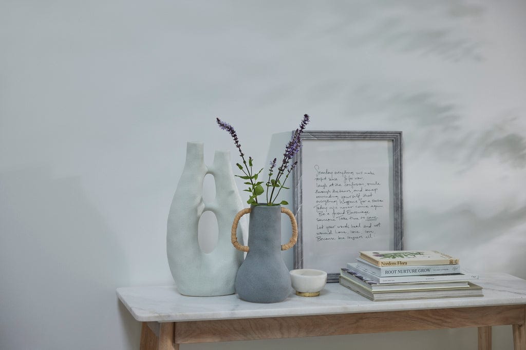 Ayla Decor Vase h41.5 cm in white ceramic on tabletop with books and framed text.