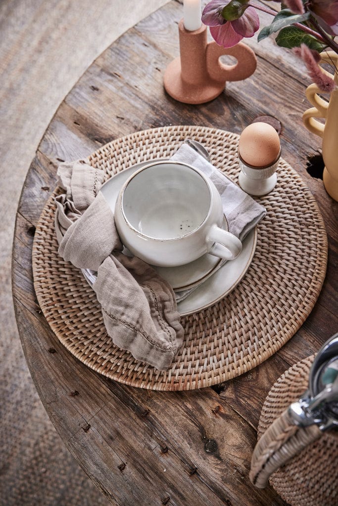 Handwoven rattan placemat, Ø35 cm, from the Norah series. Sustainable, durable, and perfect for eco-friendly dining décor.