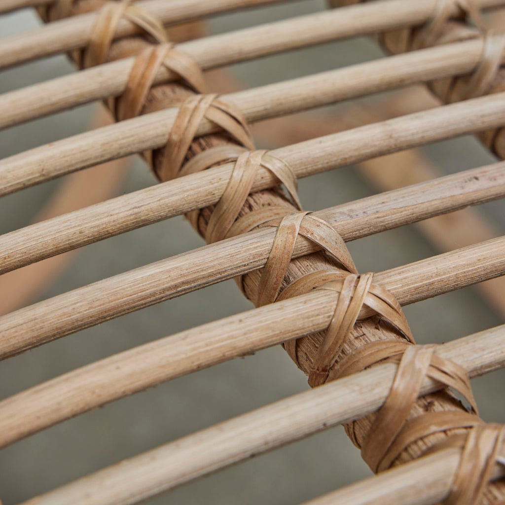 Close-up of the Norah Handwoven Rattan Dining Chair showcasing its natural, sustainable design.