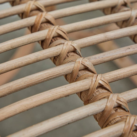 Close-up of the Norah Handwoven Rattan Dining Chair showcasing its natural, sustainable design.