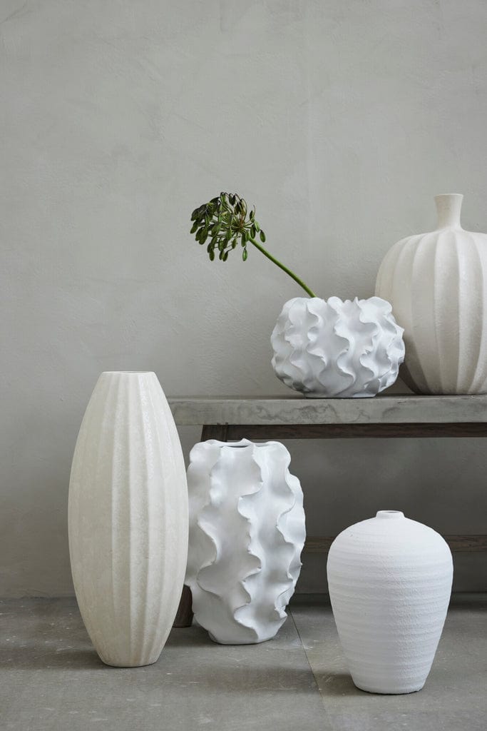 Sannia White Ceramic Vase displayed among other elegant white ceramics.