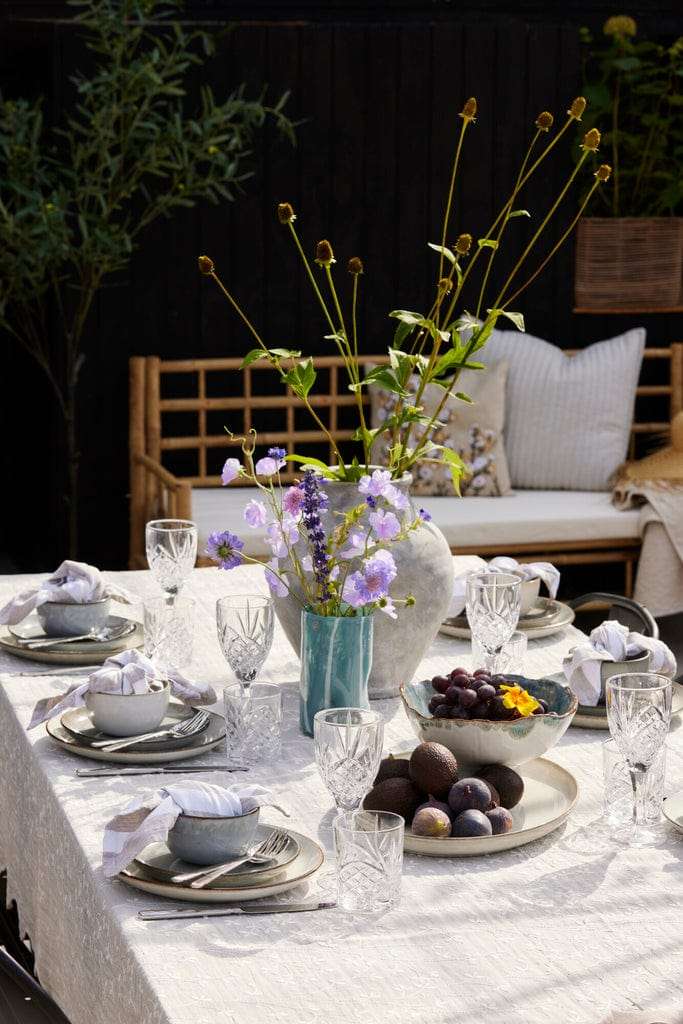 Marelle Striped Glass Vase in light blue on elegant table setting.