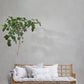 Viola Vase 33x33 cm White placed beside a rattan sofa with green plant, showcasing contemporary elegance.