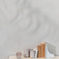 Luxurious handmade marble storage jar 11.5x9 cm on a table, part of the Ellia range.