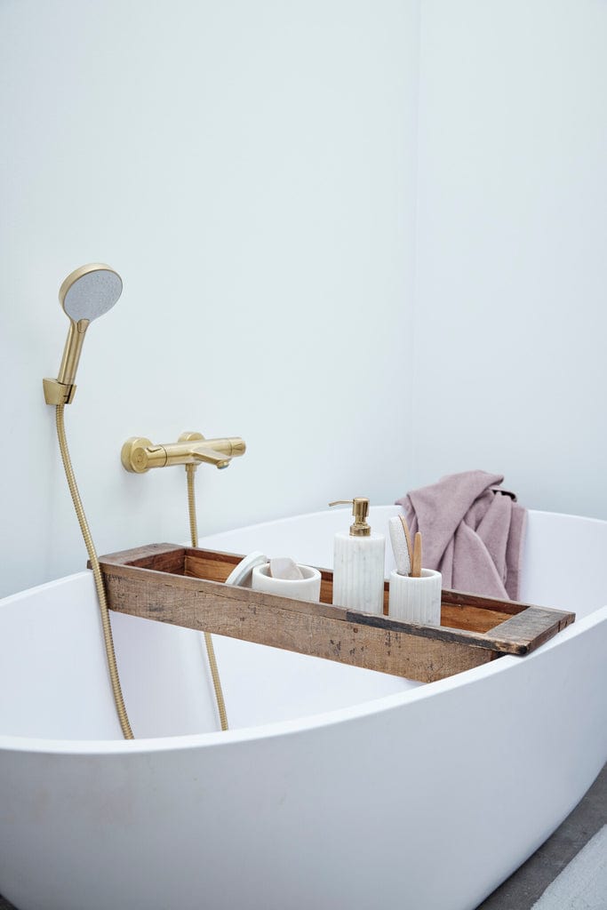 Eliana White Marble Dispenser with elegant design on bathtub tray in modern bathroom.