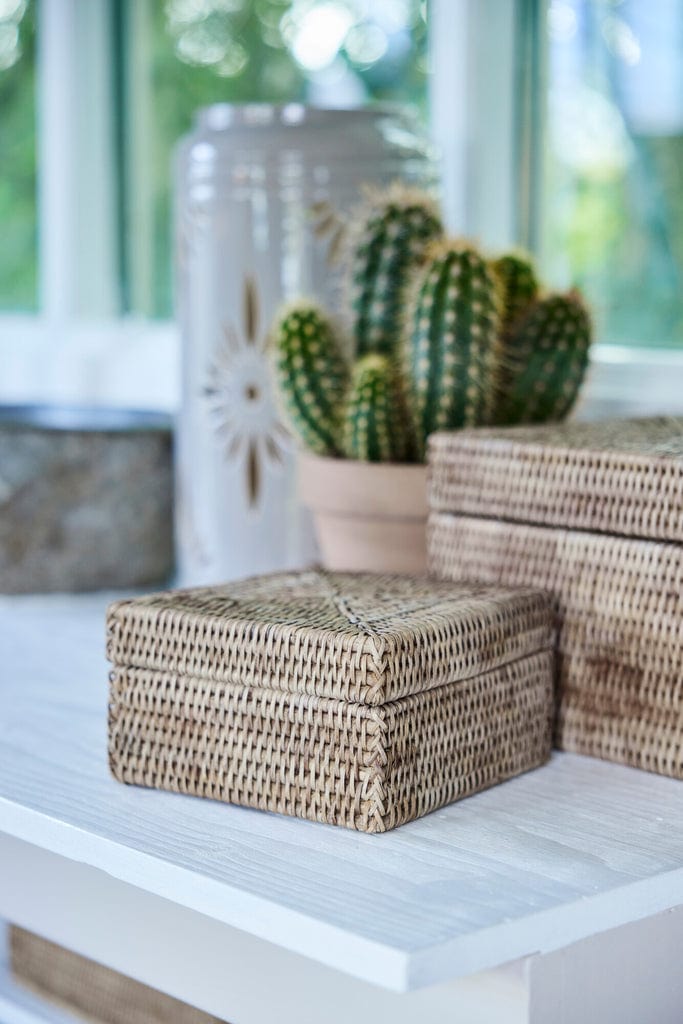 Norah Handwoven Rattan Box - Natural Rattan Storage 18x18cm on shelf.