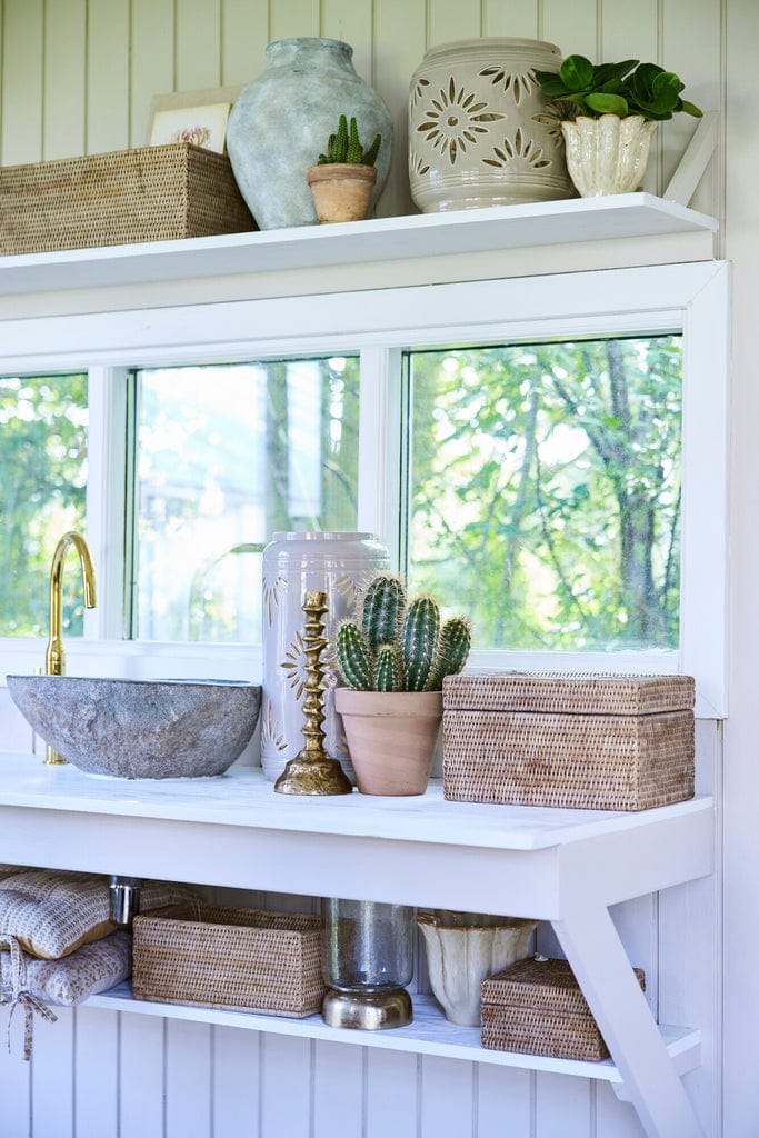 Norah Handwoven Rattan Box 30x22 cm used as natural storage on a stylish white shelf.