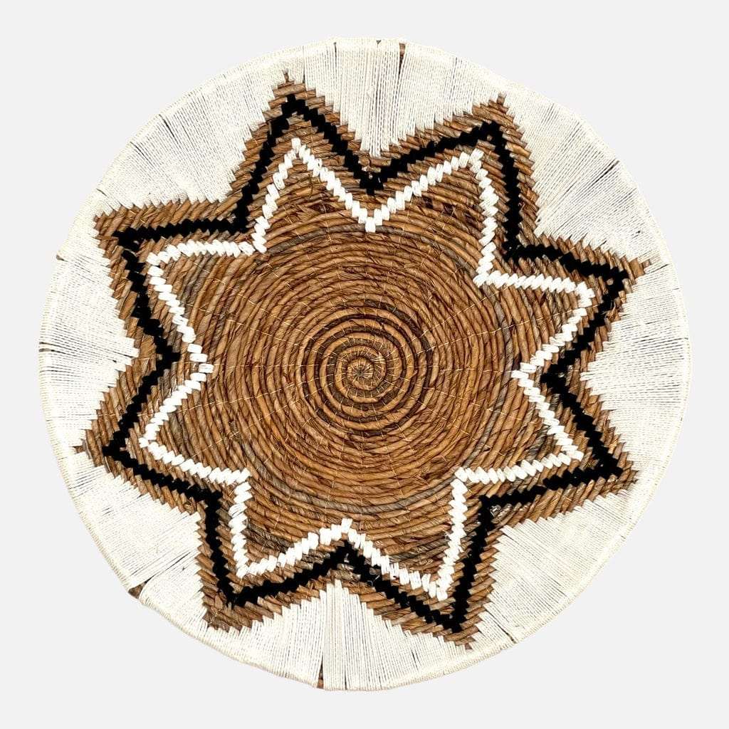 Large Pandawa handwoven wall plate made of white banana leaf and cotton with a tribal design.