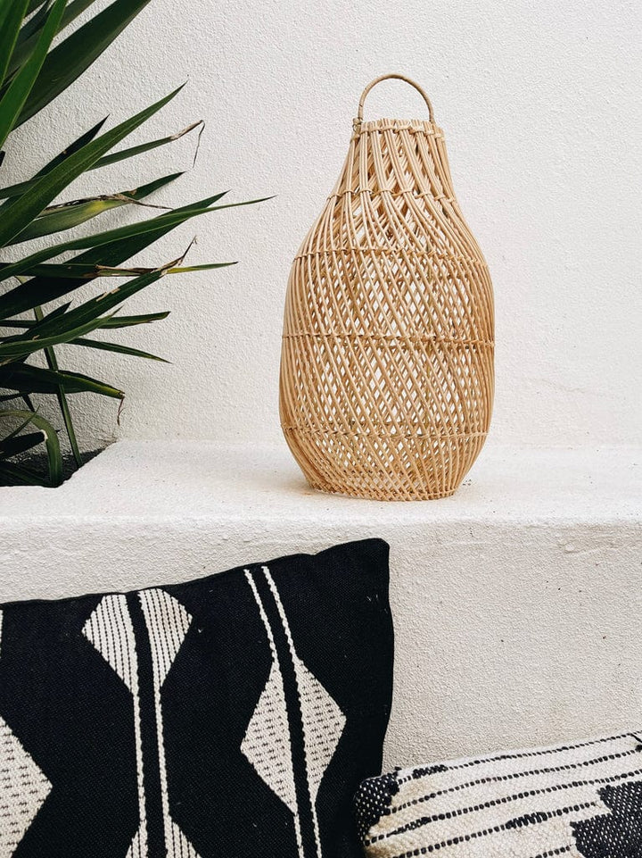 Rattan crisso cross lamp on ledge 