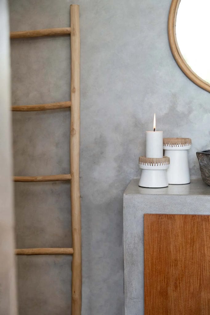 Pretty Candle Holder in white terracotta with raffia accent on tabletop.