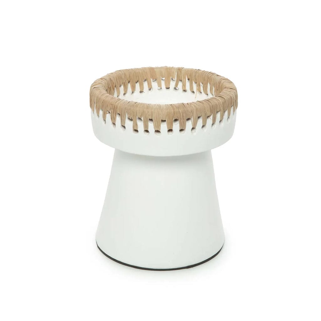 White terracotta candle holder with raffia accent.
