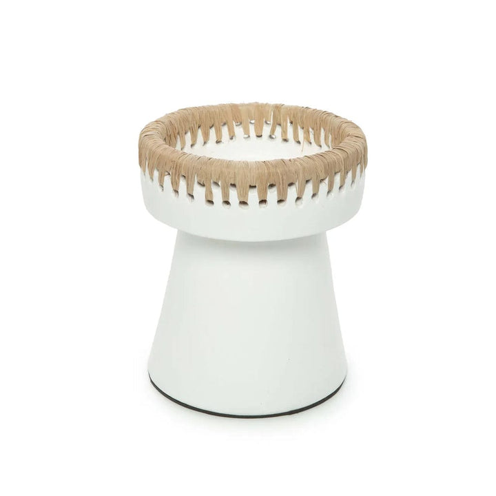 White terracotta candle holder with raffia accent.