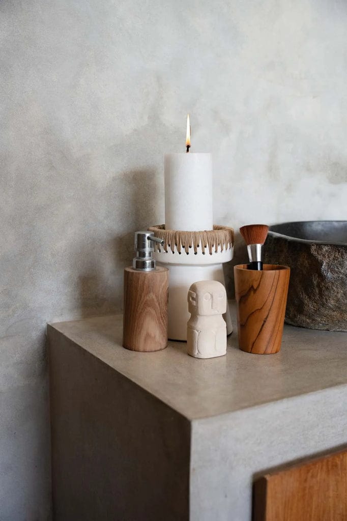 Pretty Candle Holder - White Natural with raffia accent on concrete surface.